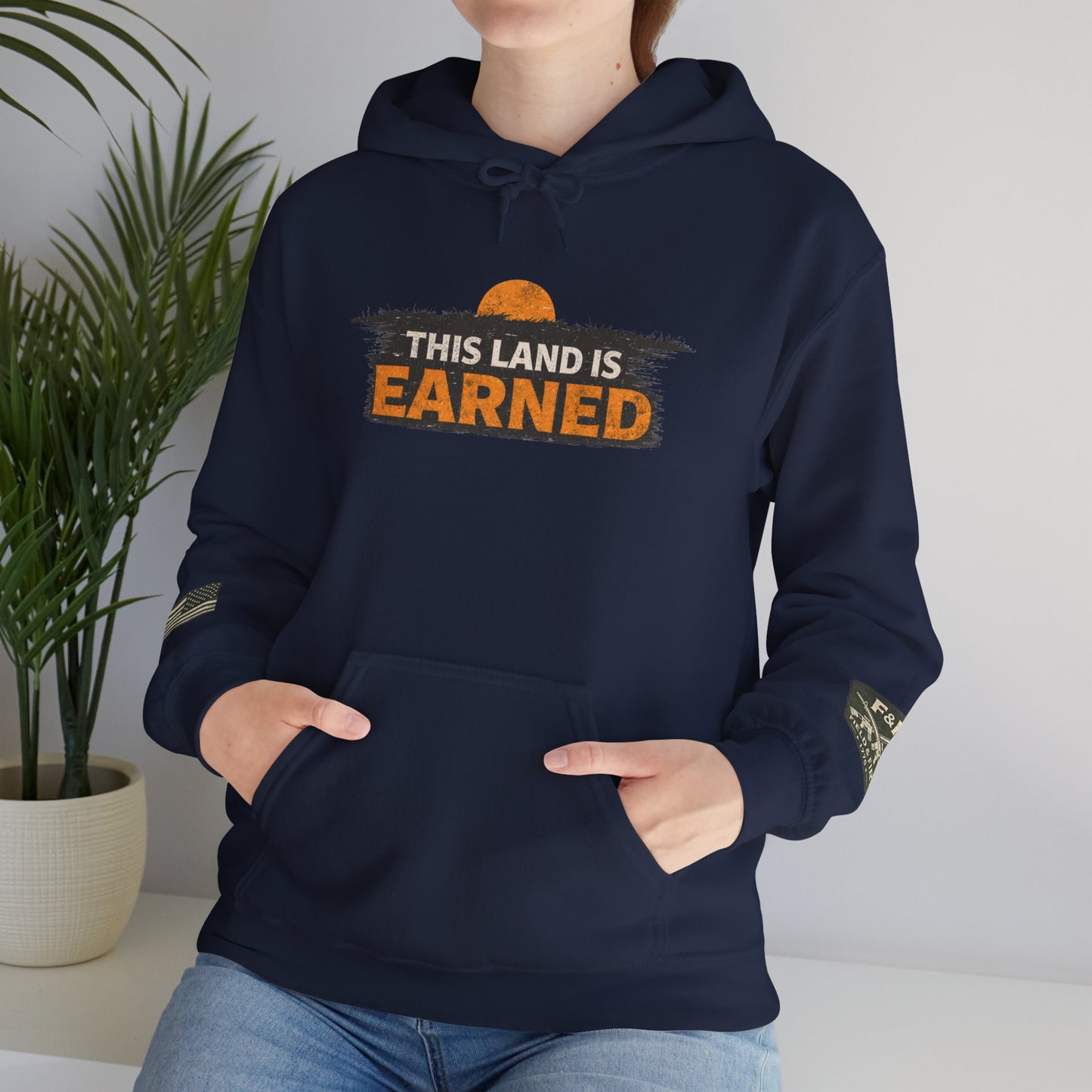 The Land Is Earned Unisex Heavy Blend™ Hooded Sweatshirt