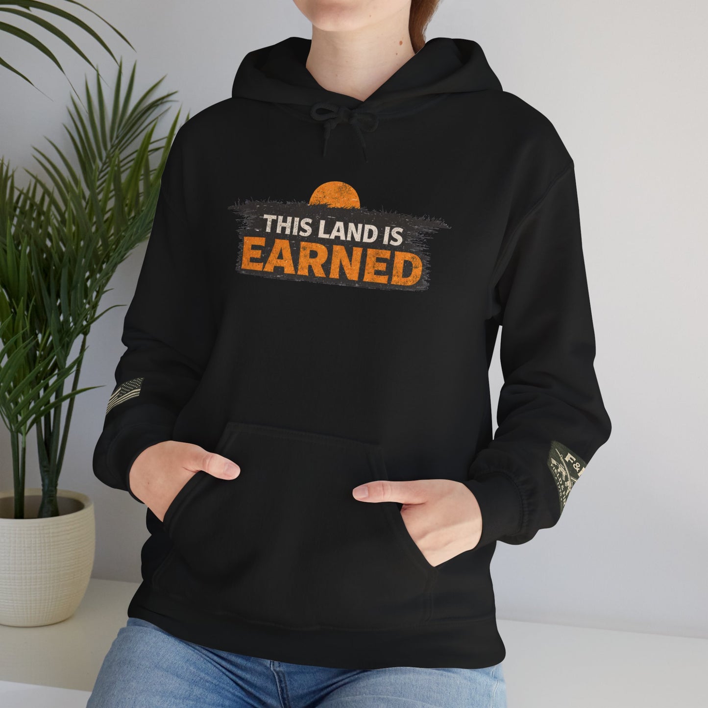 The Land Is Earned Unisex Heavy Blend™ Hooded Sweatshirt