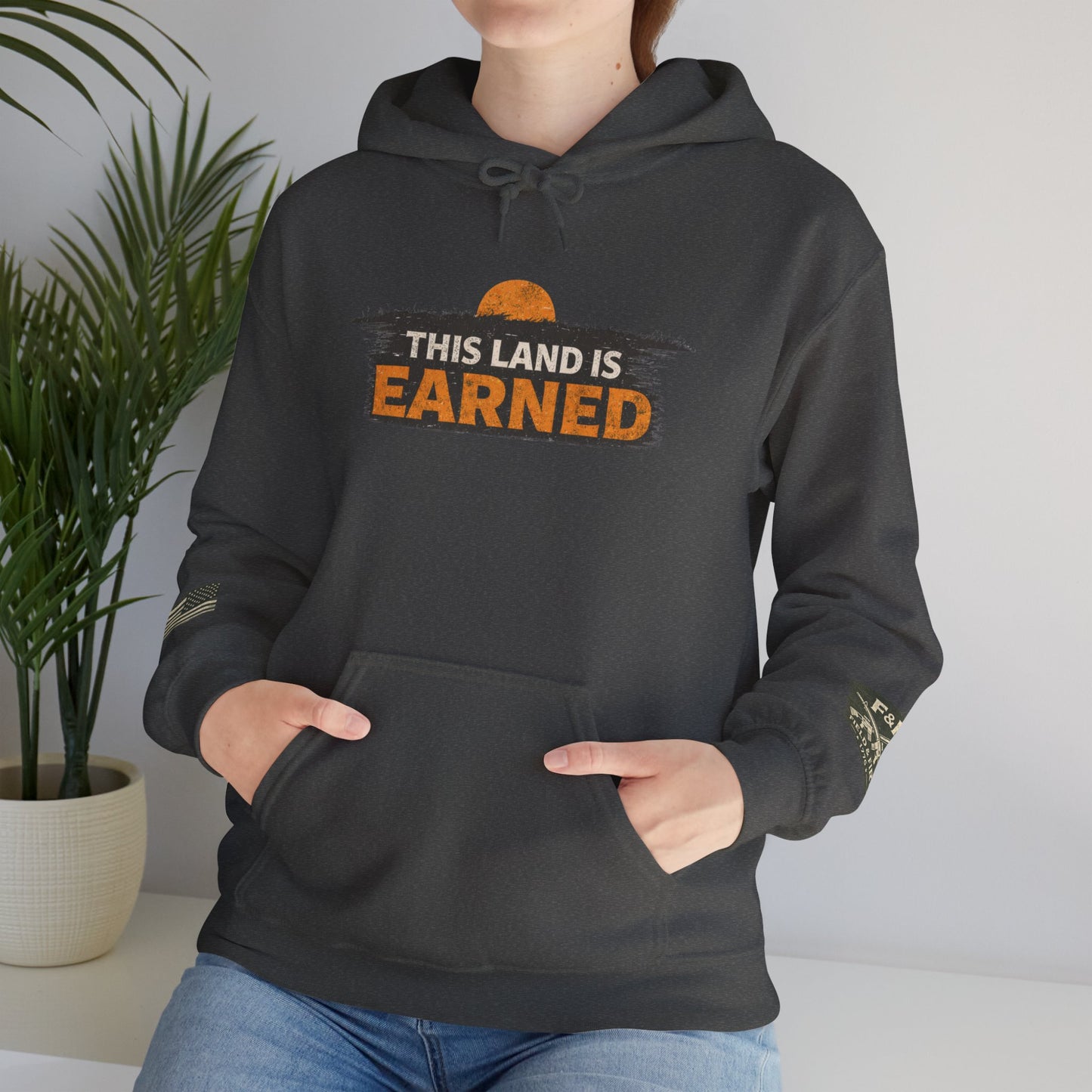 The Land Is Earned Unisex Heavy Blend™ Hooded Sweatshirt