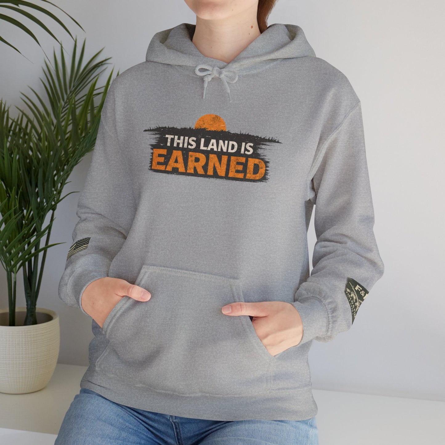 The Land Is Earned Unisex Heavy Blend™ Hooded Sweatshirt